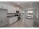 Kitchen with white cabinets, granite countertops, and island at 4443 Juliana Lake Dr, Auburndale, FL 33823