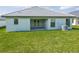Home features a large backyard with patio at 5108 Villa Crest Way, Auburndale, FL 33823