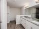 Double vanity bathroom with granite countertop and soaking tub at 5108 Villa Crest Way, Auburndale, FL 33823