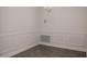 Dining room with wainscoting and wood-look tile floor at 5108 Villa Crest Way, Auburndale, FL 33823