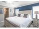 Main bedroom with ensuite bathroom and plenty of natural light at 5381 Se 129Th Ln, Belleview, FL 34420