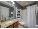 Bathroom with granite countertop, tub and shower at 5791 Woodruff Way, Lakeland, FL 33812