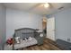 Gray bedroom with crib, changing table and wood flooring at 5791 Woodruff Way, Lakeland, FL 33812