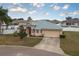 One-story home with a two-car garage and landscaped yard at 5791 Woodruff Way, Lakeland, FL 33812