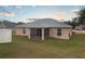 Single-story house with screened patio and fenced backyard at 5791 Woodruff Way, Lakeland, FL 33812