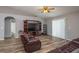 Living room with hardwood floors, recessed lighting, and a TV at 5791 Woodruff Way, Lakeland, FL 33812