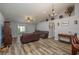 Living room with hardwood floors and a ceiling fan at 5791 Woodruff Way, Lakeland, FL 33812
