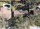 Aerial view of houses and backyard with pool at 611 Limber Ln, Lakeland, FL 33810