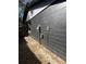 Black painted exterior wall with utilities at 611 Limber Ln, Lakeland, FL 33810