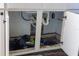 Under-sink area of kitchen cabinet with debris at 611 Limber Ln, Lakeland, FL 33810
