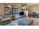 Living room with couches, ottoman, and TV at 611 Limber Ln, Lakeland, FL 33810