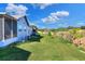 Large backyard with grassy lawn and screened patio at 6243 Egret Dr, Lakeland, FL 33809