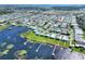 Aerial view of home by the lake with water access at 6683 Briarhill Ne Dr, Winter Haven, FL 33881