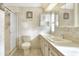 Clean bathroom with shower, toilet, vanity, and medicine cabinet at 6683 Briarhill Ne Dr, Winter Haven, FL 33881
