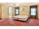 Spacious bedroom with a comfortable bed and carpet flooring at 6683 Briarhill Ne Dr, Winter Haven, FL 33881