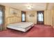 Large bedroom with double bed and ceiling fan at 6683 Briarhill Ne Dr, Winter Haven, FL 33881