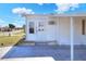 White single-wide home with covered entry at 6683 Briarhill Ne Dr, Winter Haven, FL 33881