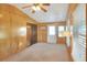 Sunroom with wood paneling, sliding door, and windows at 6683 Briarhill Ne Dr, Winter Haven, FL 33881