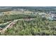 Aerial view showing the property's location near green spaces and a pond at 8205 Roseville, Davenport, FL 33896