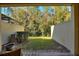 Private backyard with grassy area and trees at 8205 Roseville, Davenport, FL 33896