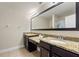 Double vanity bathroom with granite countertops and ample storage at 8205 Roseville, Davenport, FL 33896