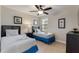 Bedroom with two twin beds, nightstand, and ceiling fan at 8205 Roseville, Davenport, FL 33896