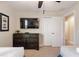 Bedroom with two twin beds, dresser, and large TV at 8205 Roseville, Davenport, FL 33896