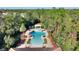 Large community pool with a surrounding patio and plenty of lounge chairs at 8205 Roseville, Davenport, FL 33896