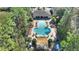 Community pool area with a spa, pergola, and plenty of lounge chairs at 8205 Roseville, Davenport, FL 33896