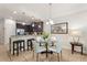 Bright dining area with a glass-top table and white chairs at 8205 Roseville, Davenport, FL 33896