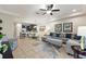 Open concept living room with a view into the kitchen and dining area at 8205 Roseville, Davenport, FL 33896