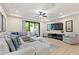 Spacious living room with sectional sofa, large TV, and plenty of natural light at 8205 Roseville, Davenport, FL 33896