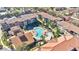 Aerial view of community showing pool, landscaping, and building layout at 904 Charo Pkwy # 517, Davenport, FL 33897