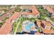 Aerial view of apartment buildings with pool and green areas at 904 Charo Pkwy # 517, Davenport, FL 33897