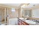 Elegant bathroom with double vanity, soaking tub and walk-in shower at 904 Charo Pkwy # 517, Davenport, FL 33897
