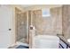 Spa-like bathroom with a large walk-in shower and soaking tub at 904 Charo Pkwy # 517, Davenport, FL 33897
