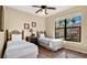Cozy bedroom with two twin beds and large window overlooking the backyard at 904 Charo Pkwy # 517, Davenport, FL 33897