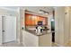 Modern kitchen with dark wood cabinets and granite countertops at 904 Charo Pkwy # 517, Davenport, FL 33897