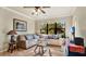 Spacious living room featuring a comfortable sectional sofa and large windows at 904 Charo Pkwy # 517, Davenport, FL 33897