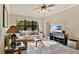 Bright and airy living room with a large sectional sofa and tile floors at 904 Charo Pkwy # 517, Davenport, FL 33897