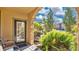 Private patio with seating area, lush landscaping, and community view at 904 Charo Pkwy # 517, Davenport, FL 33897