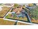 Aerial view showcasing a home with a pool and fenced backyard at 7525 Jessamine Dr, Lakeland, FL 33810