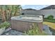 Clean hot tub with wooden deck, ready for relaxation at 7525 Jessamine Dr, Lakeland, FL 33810