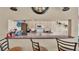 Kitchen view from the breakfast bar with a microwave and stovetop at 7525 Jessamine Dr, Lakeland, FL 33810