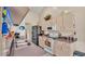 Kitchen with white appliances, wood cabinets, and granite countertops at 7525 Jessamine Dr, Lakeland, FL 33810
