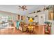 Bright living room with hardwood floors, a sectional sofa, and sliding doors to a patio at 7525 Jessamine Dr, Lakeland, FL 33810