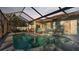 Inviting kidney-shaped pool with screened enclosure at 7525 Jessamine Dr, Lakeland, FL 33810