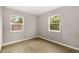 Simple bedroom with tile flooring and two windows at 2473 Barbarossa, Deltona, FL 32738