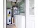 Laundry room with washer, dryer, water heater, and AC unit at 2473 Barbarossa, Deltona, FL 32738