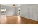 Living room with hardwood floors, large windows, and ceiling fan at 2473 Barbarossa, Deltona, FL 32738